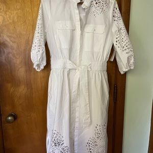 White House, Black market, white cotton eyelet dress or jacket.